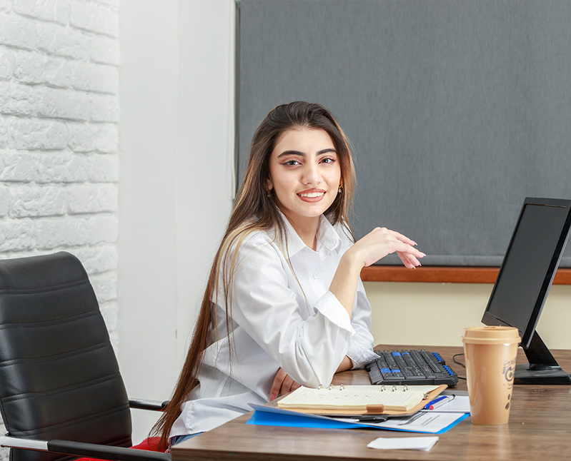 Employee with black desktop
